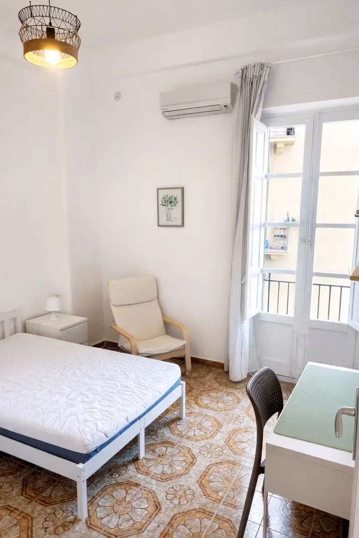 Student room in with study area and shared facilities