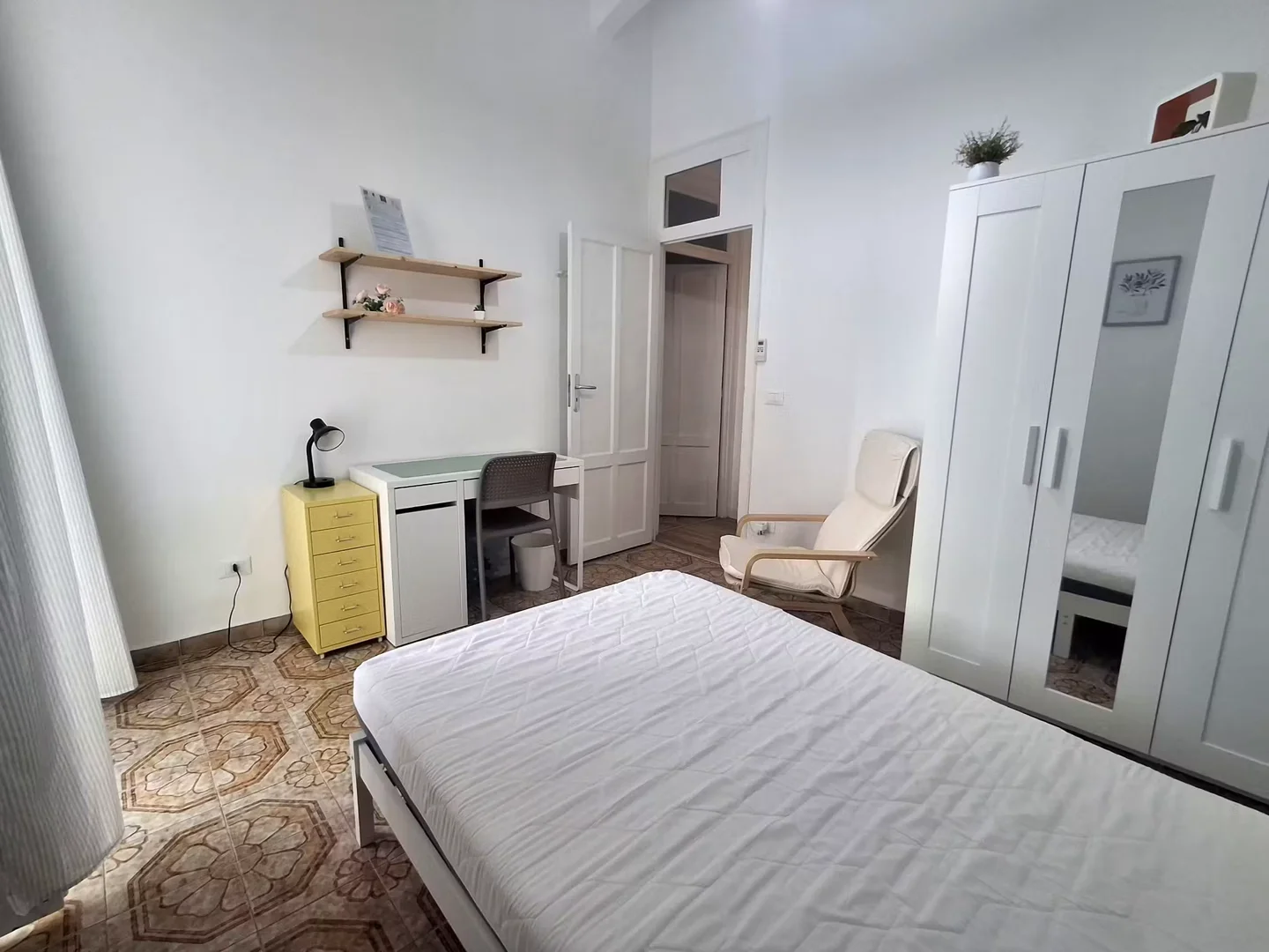 Student room in with study area and shared facilities