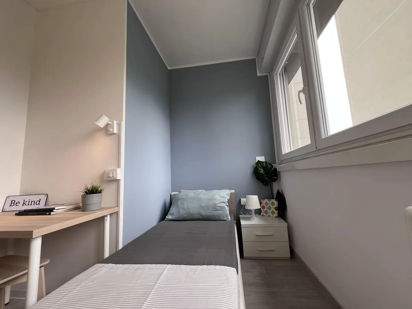 Student room in with study area and shared facilities