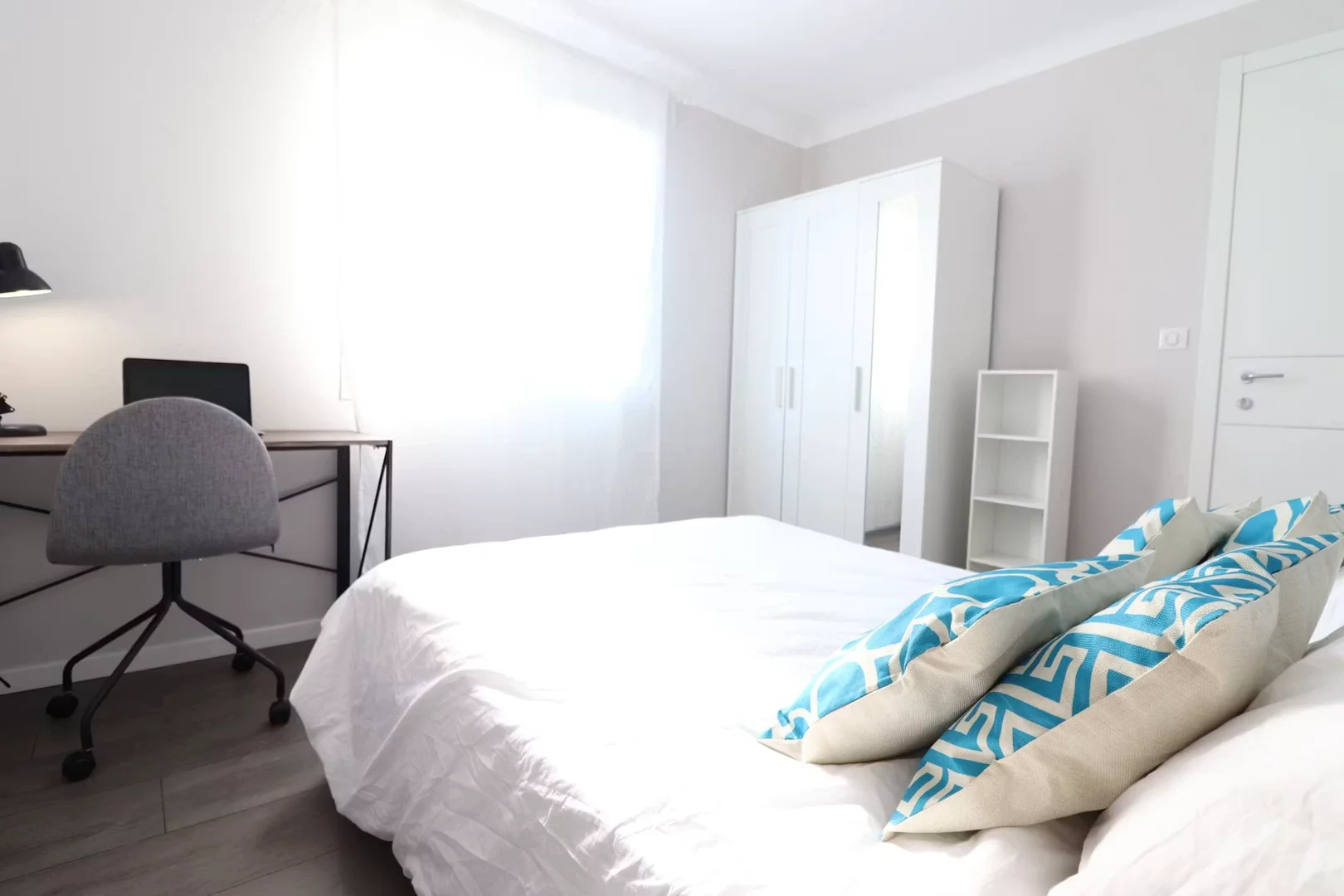 Student room in with study area and shared facilities