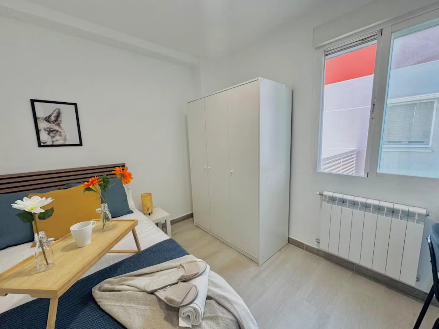 Student room in with study area and shared facilities