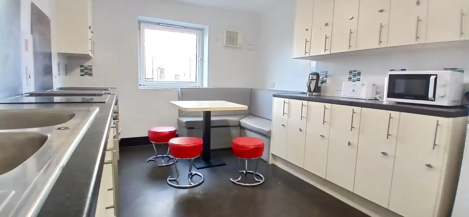 Student room in with study area and shared facilities