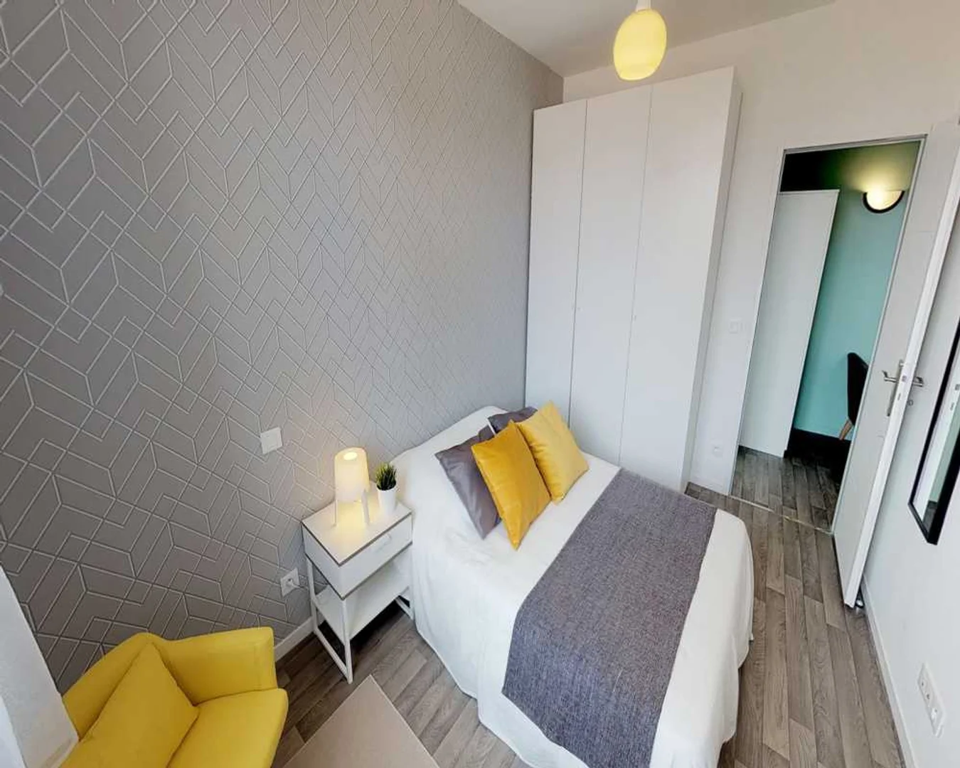 Student room in with study area and shared facilities
