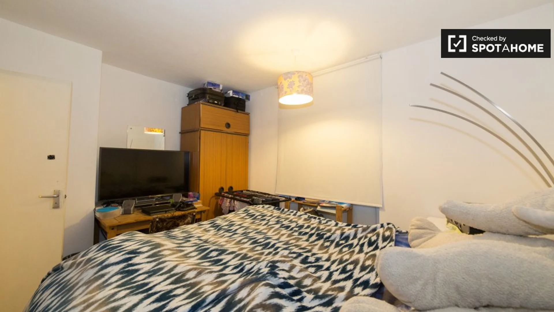 Student room in with study area and shared facilities