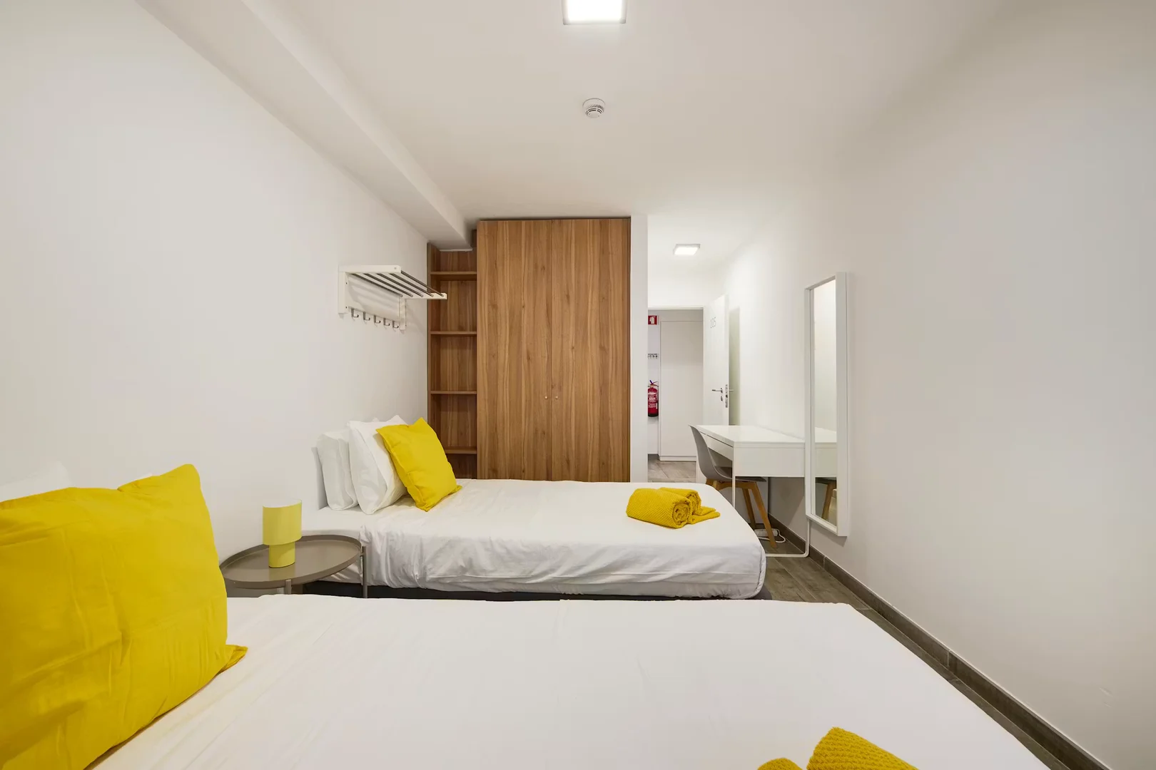 Student room in with study area and shared facilities