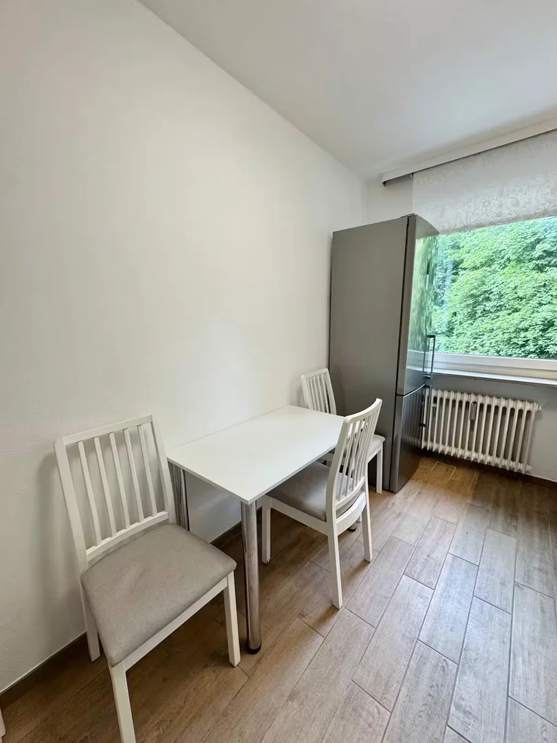 Student room in with study area and shared facilities