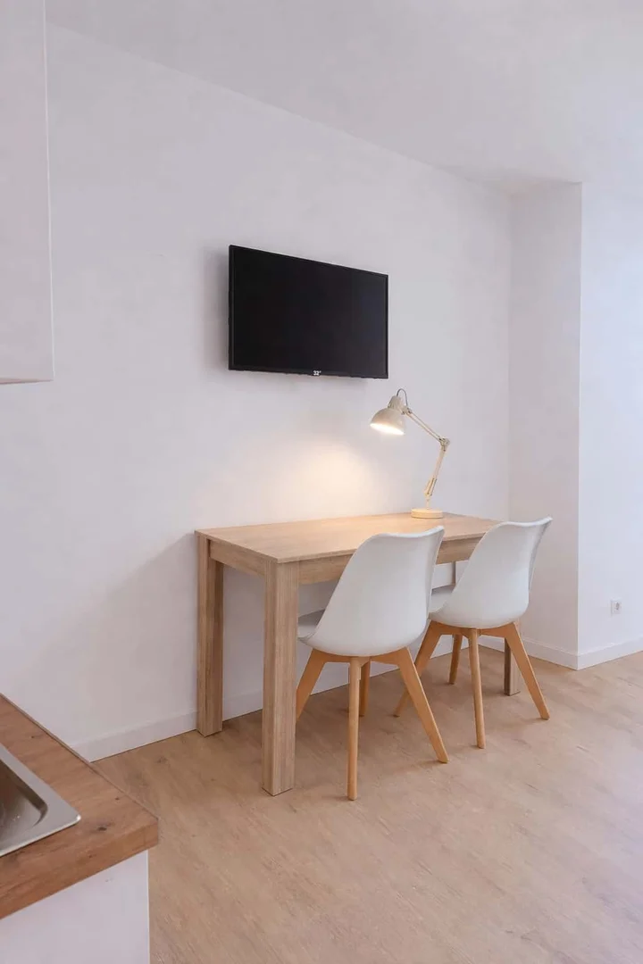 Student room in  with study area and shared facilities