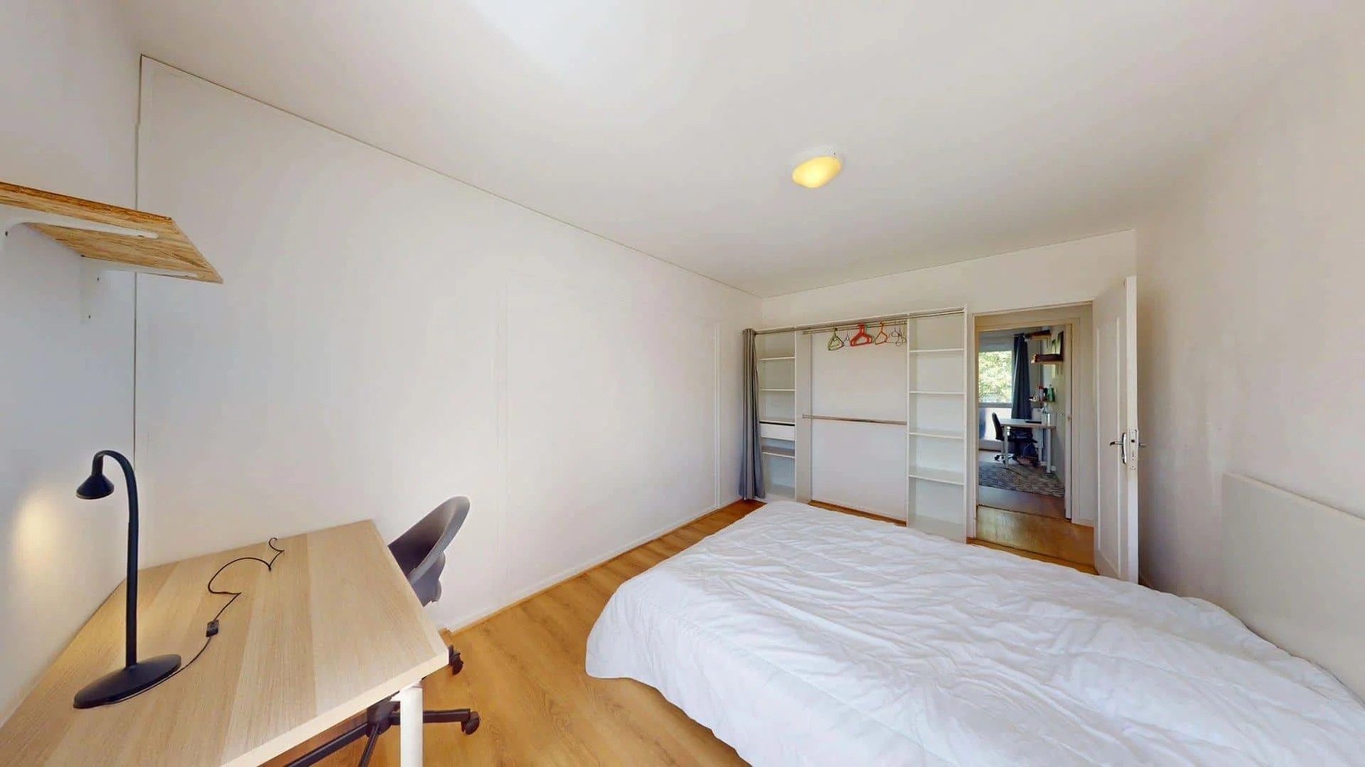 Student room in with study area and shared facilities