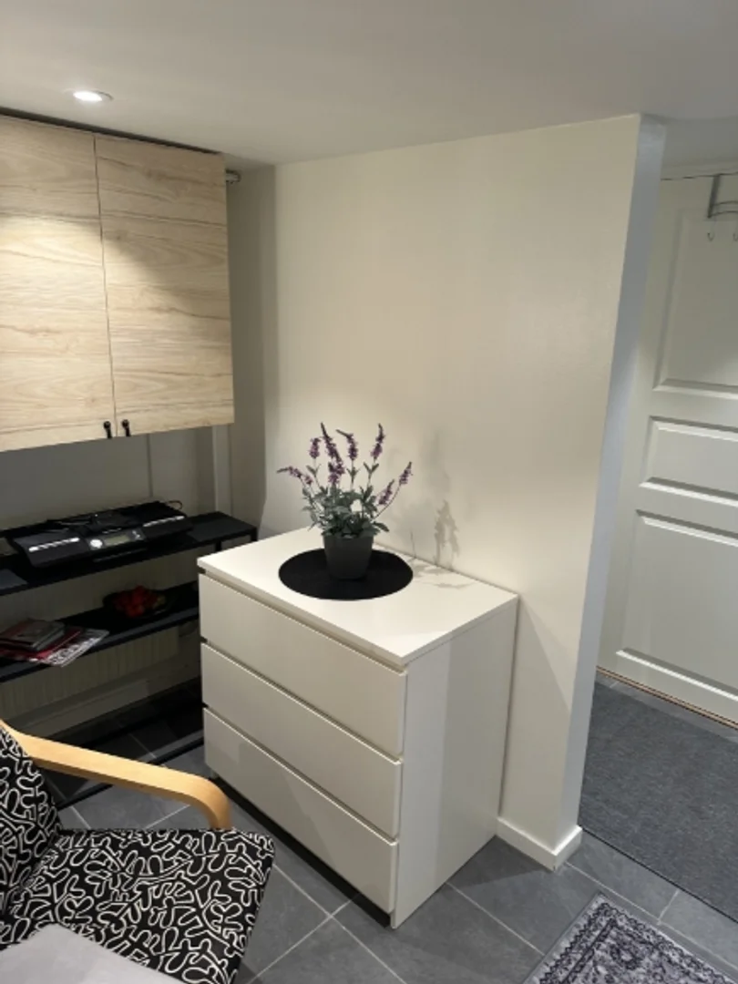 Student room in with study area and shared facilities
