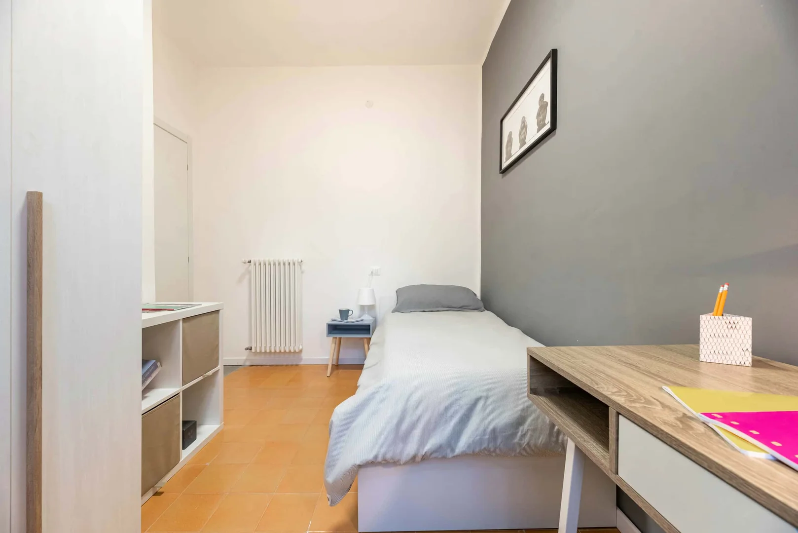 Student room in with study area and shared facilities