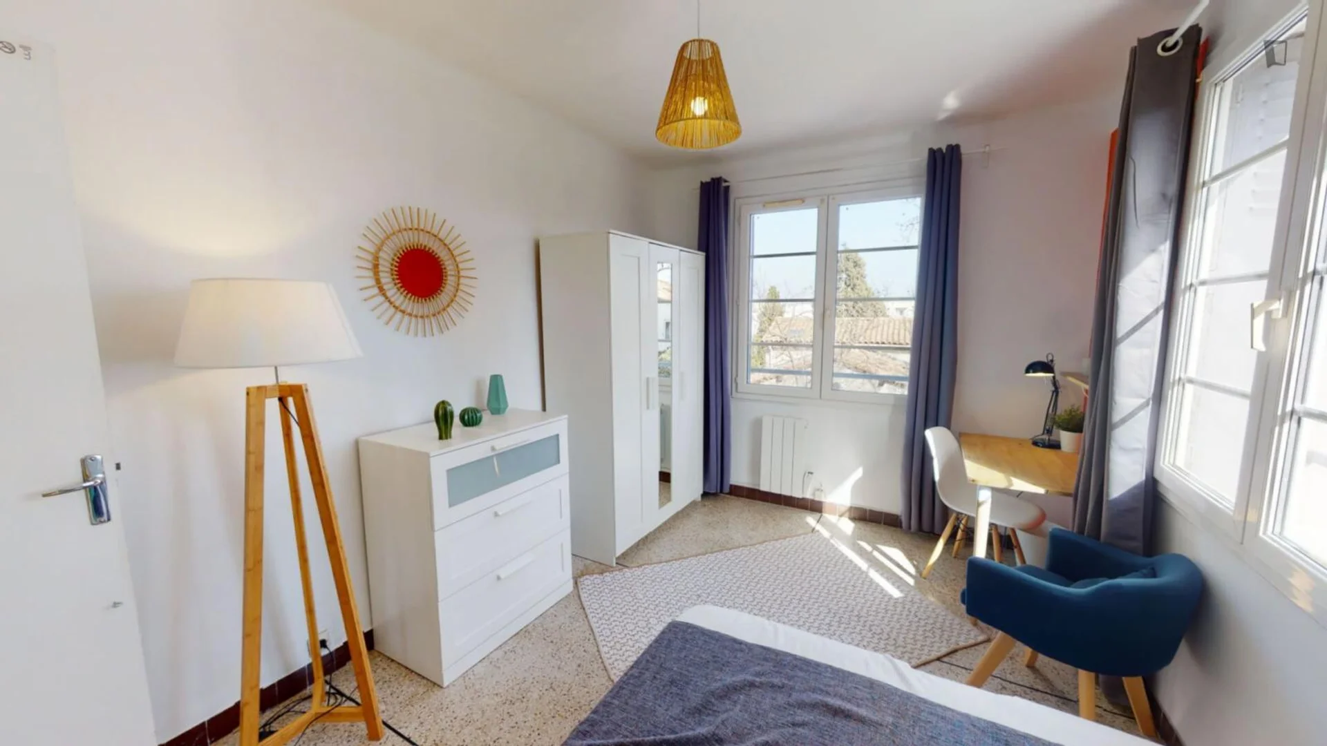 Student room in with study area and shared facilities