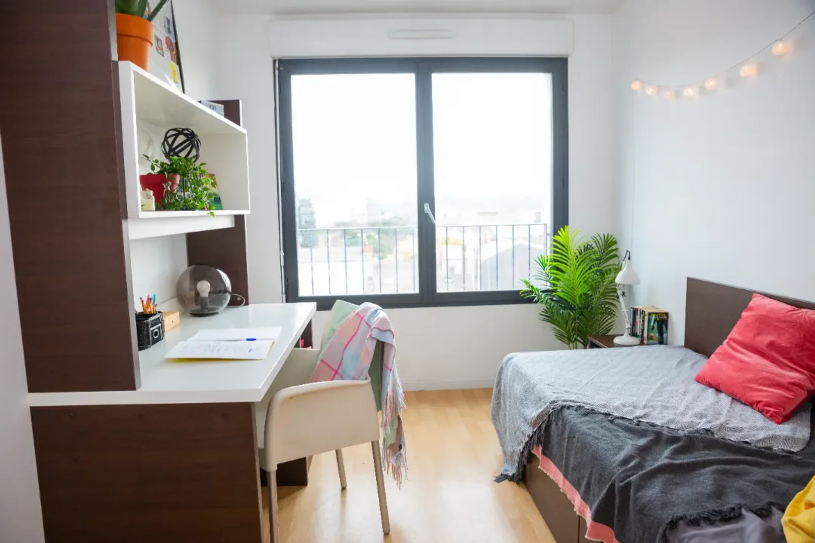 Student room in with study area and shared facilities