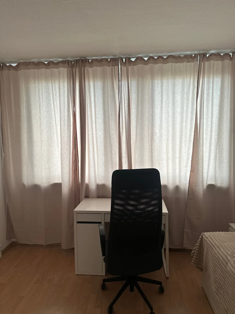 Student room in  with study area and shared facilities