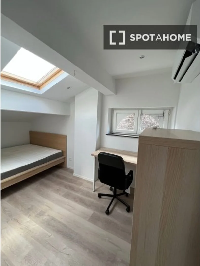 Student room in  with study area and shared facilities