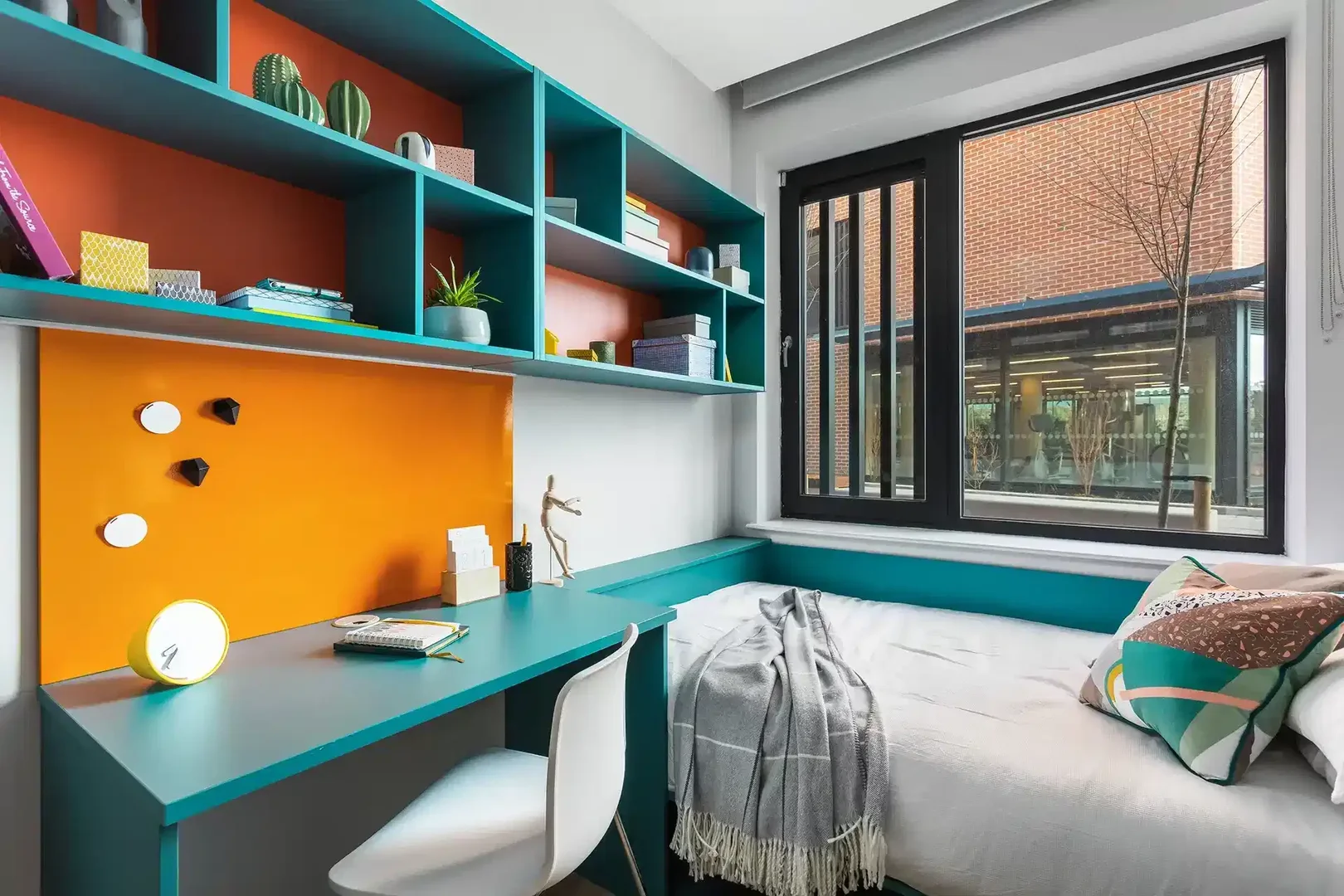 Student room in with study area and shared facilities