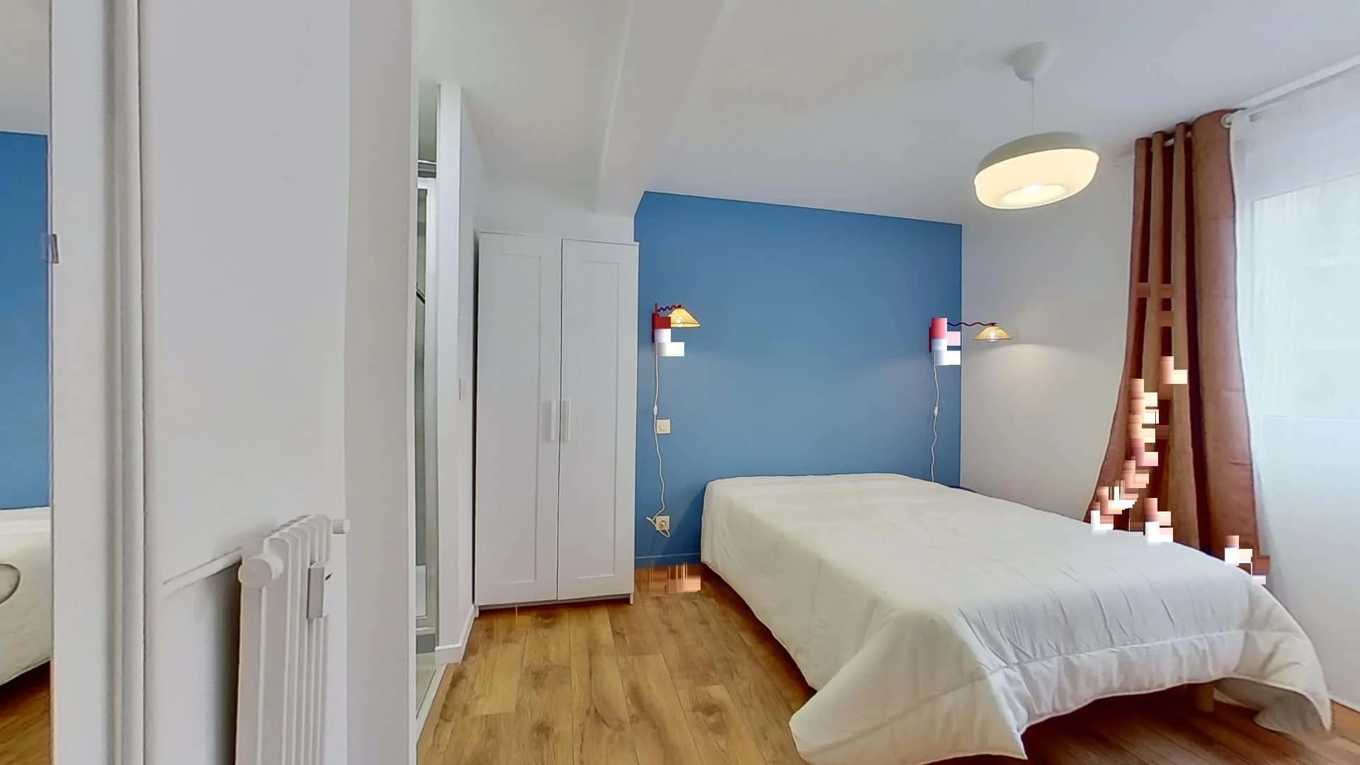Student room in with study area and shared facilities