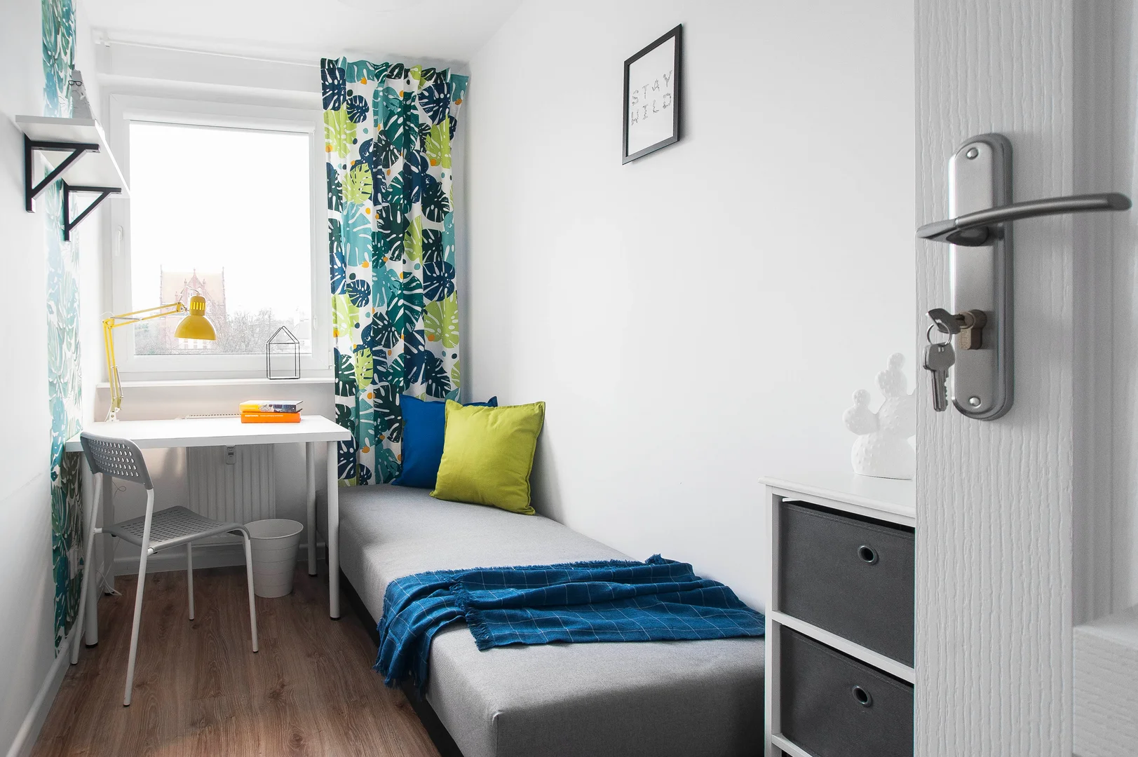 Student room in with study area and shared facilities