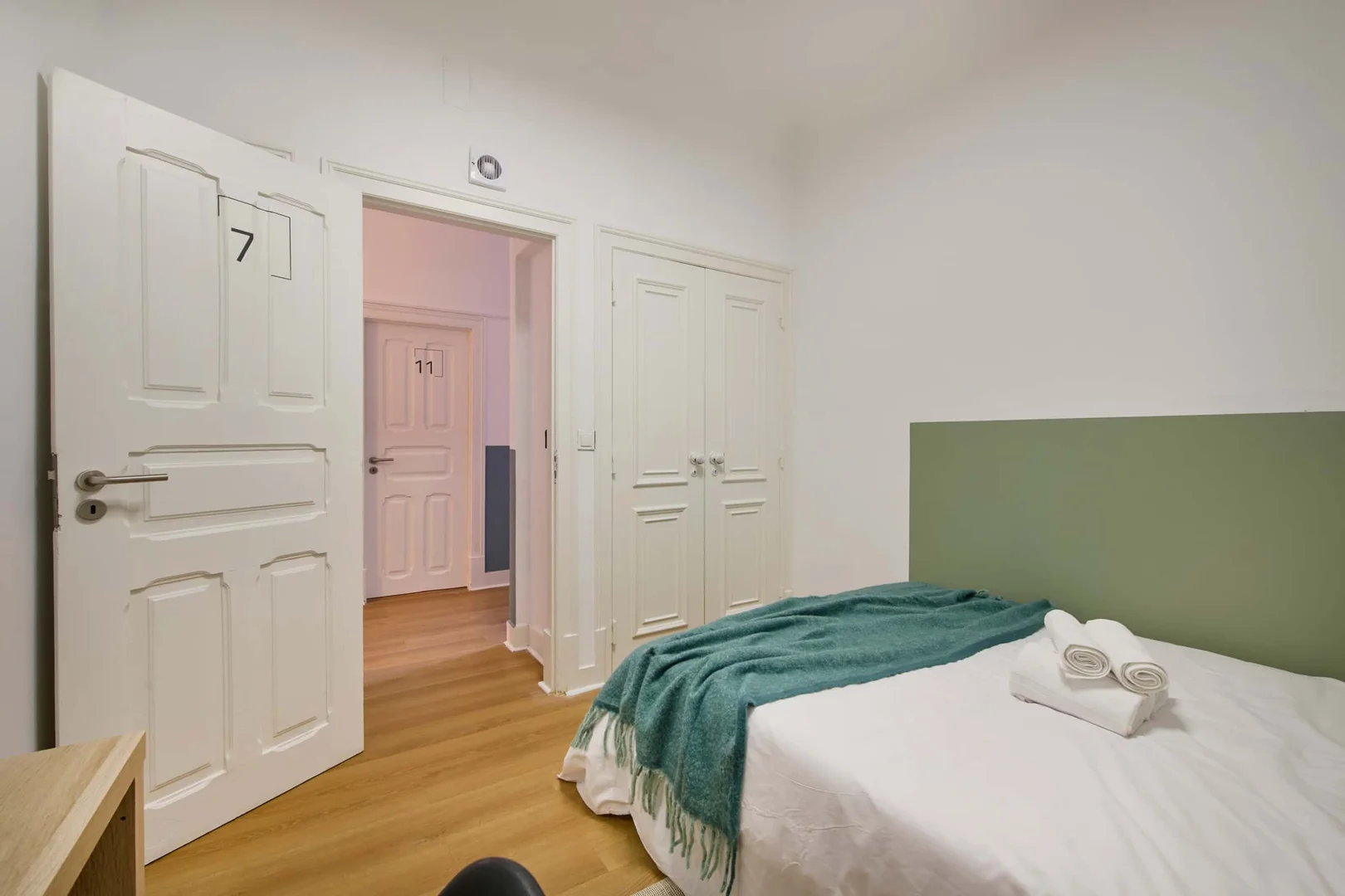Student room in with study area and shared facilities
