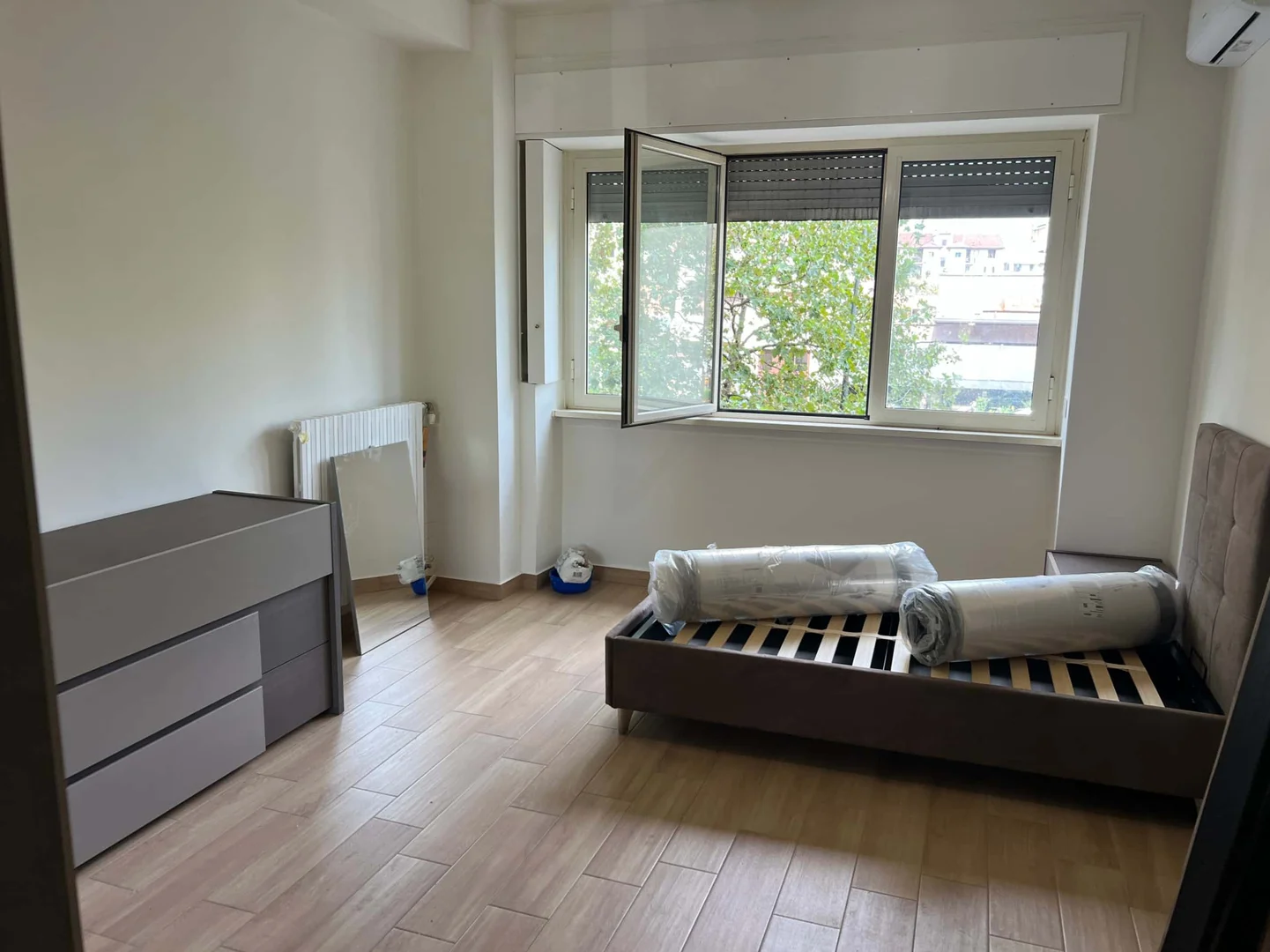 Student room in with study area and shared facilities