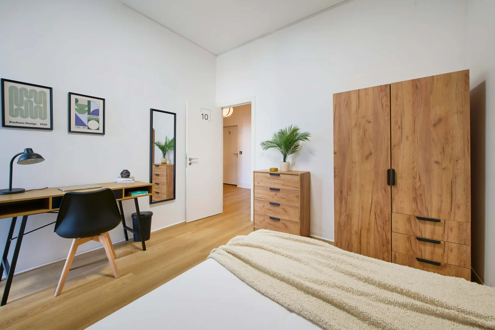 Student room in with study area and shared facilities