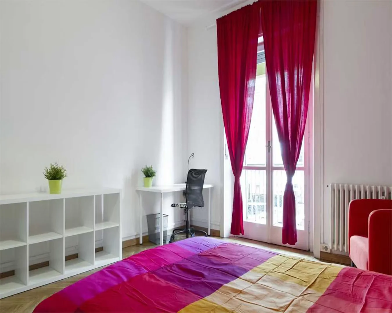 Student room in with study area and shared facilities