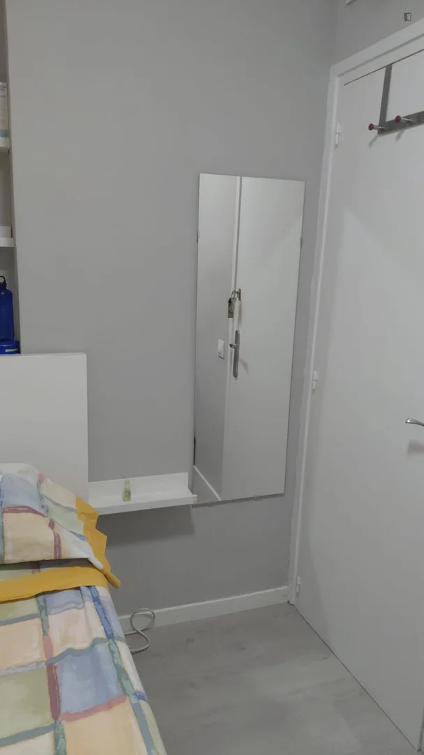 Student room in with study area and shared facilities