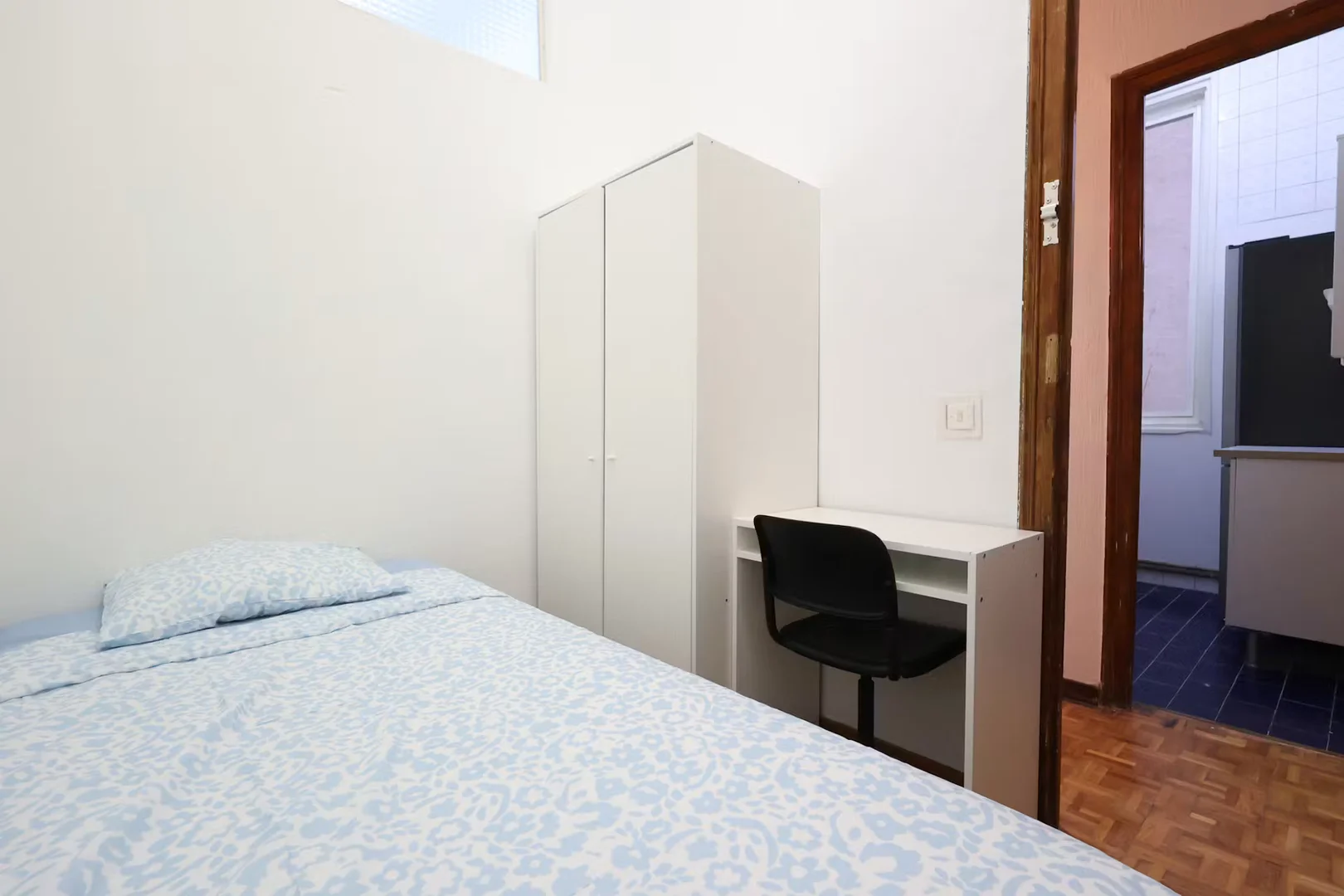 Student room in with study area and shared facilities