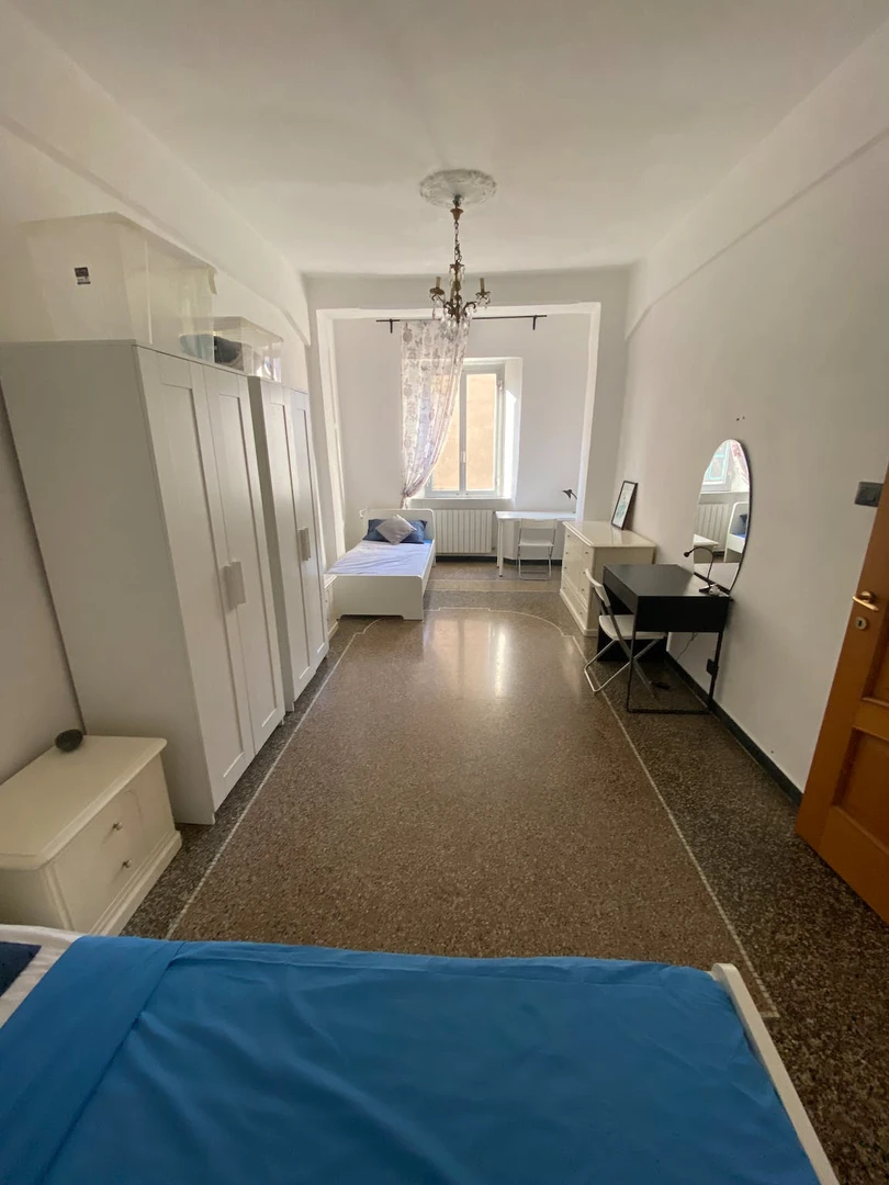 Bright shared room for rent in Genoa
