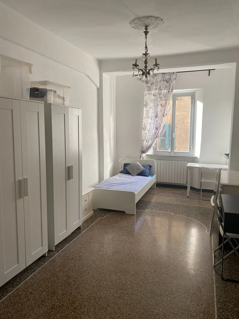 Bright shared room for rent in Genoa