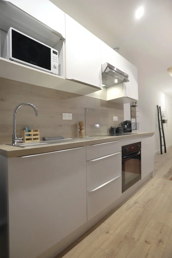 Student room in with study area and shared facilities