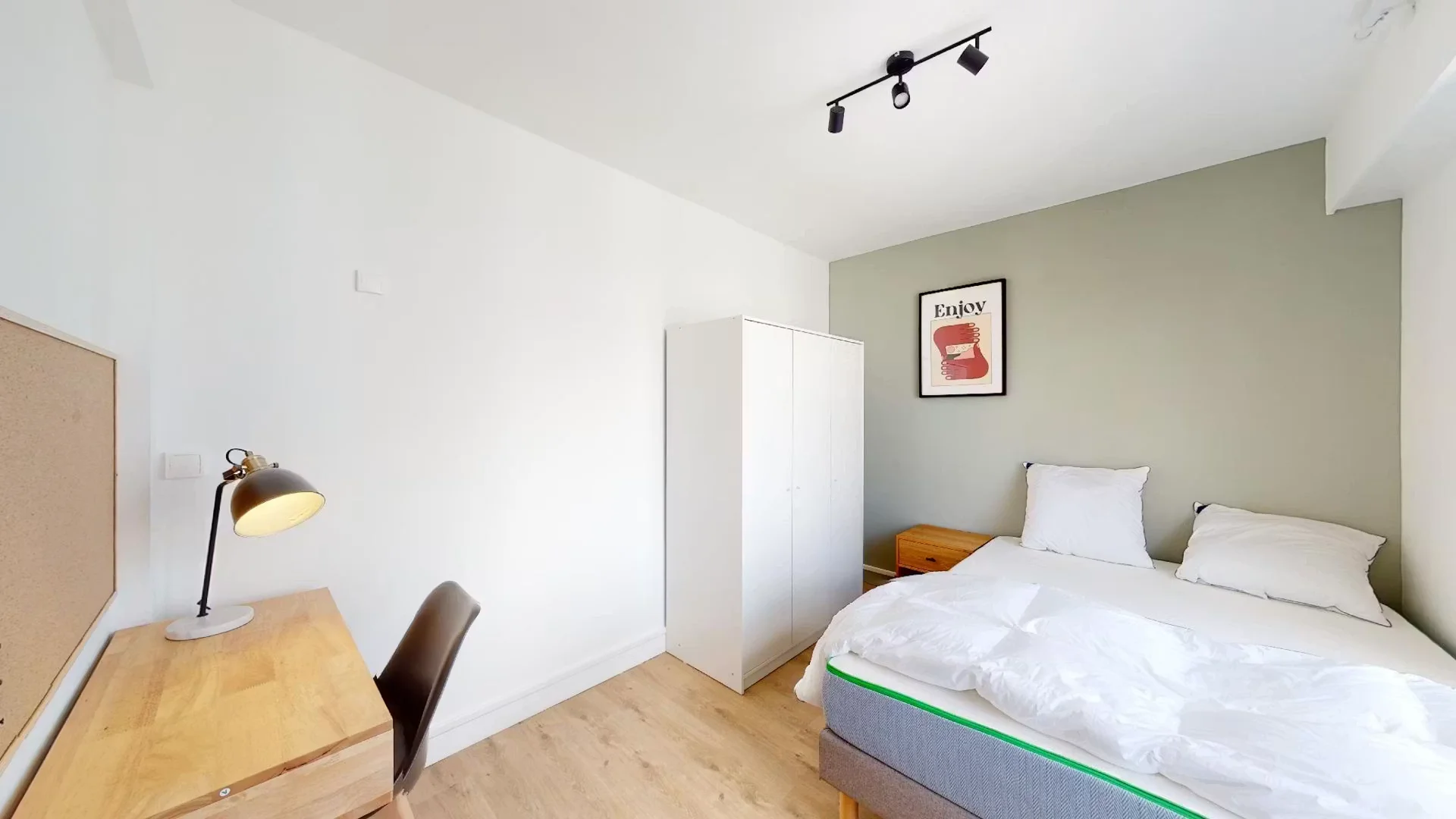Student room in with study area and shared facilities