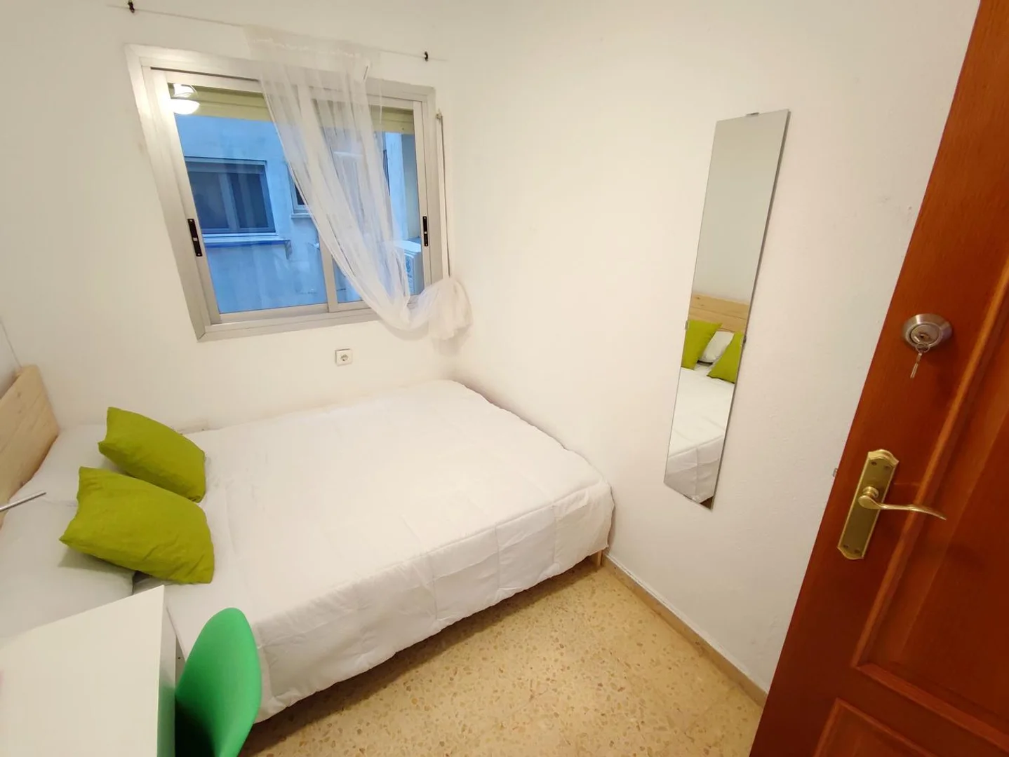Student room in with study area and shared facilities