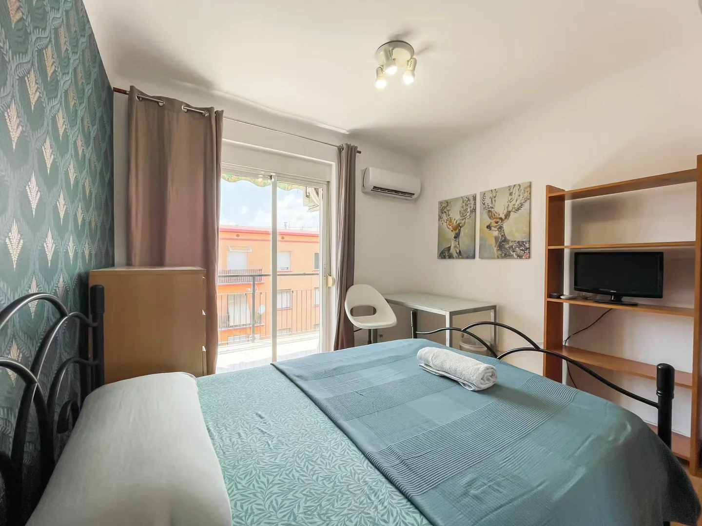 Student room in with study area and shared facilities