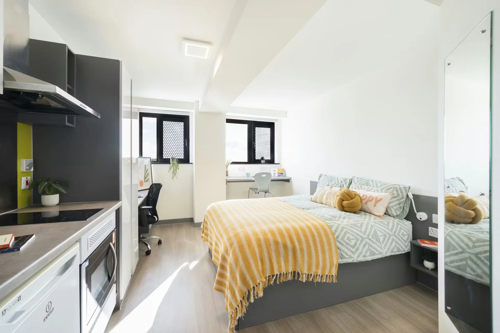 Student room in with study area and shared facilities