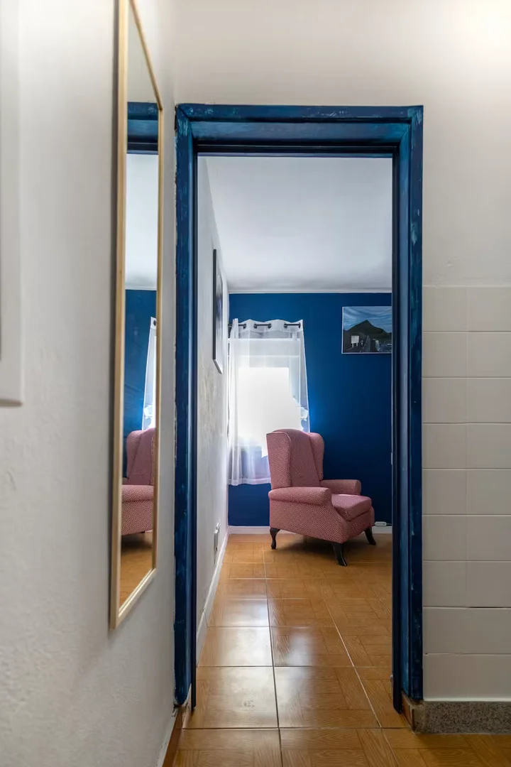Student room in with study area and shared facilities
