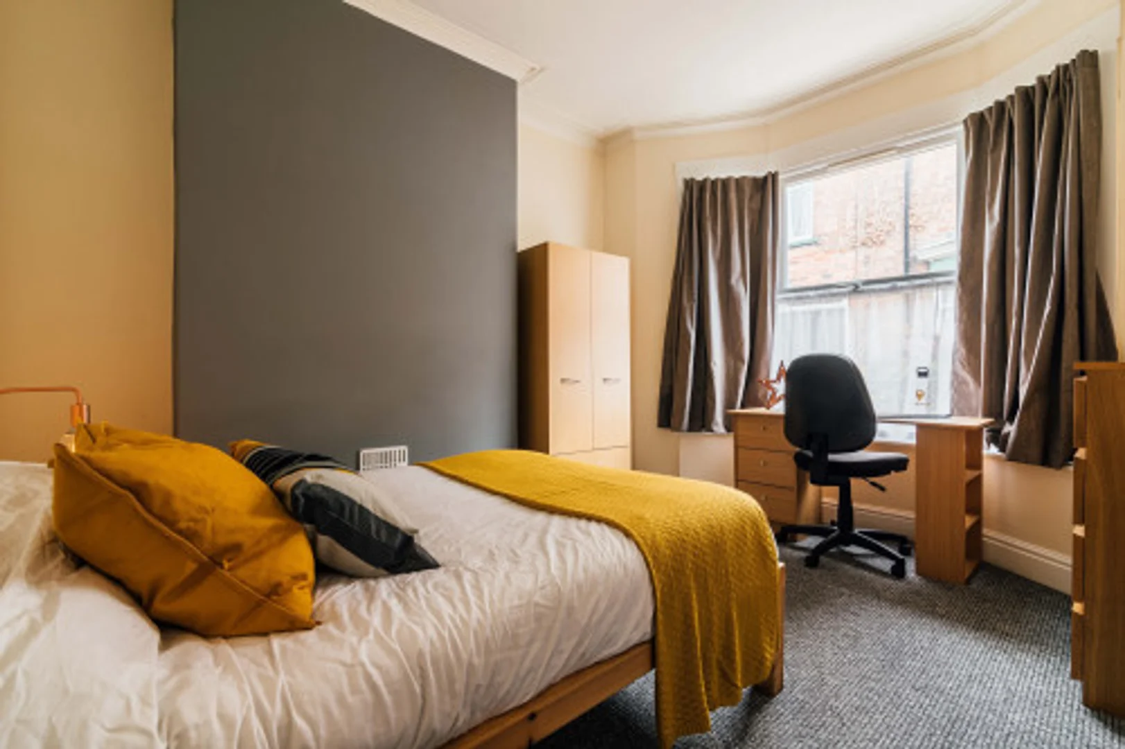 Affordable room for students with ample lighting in 
