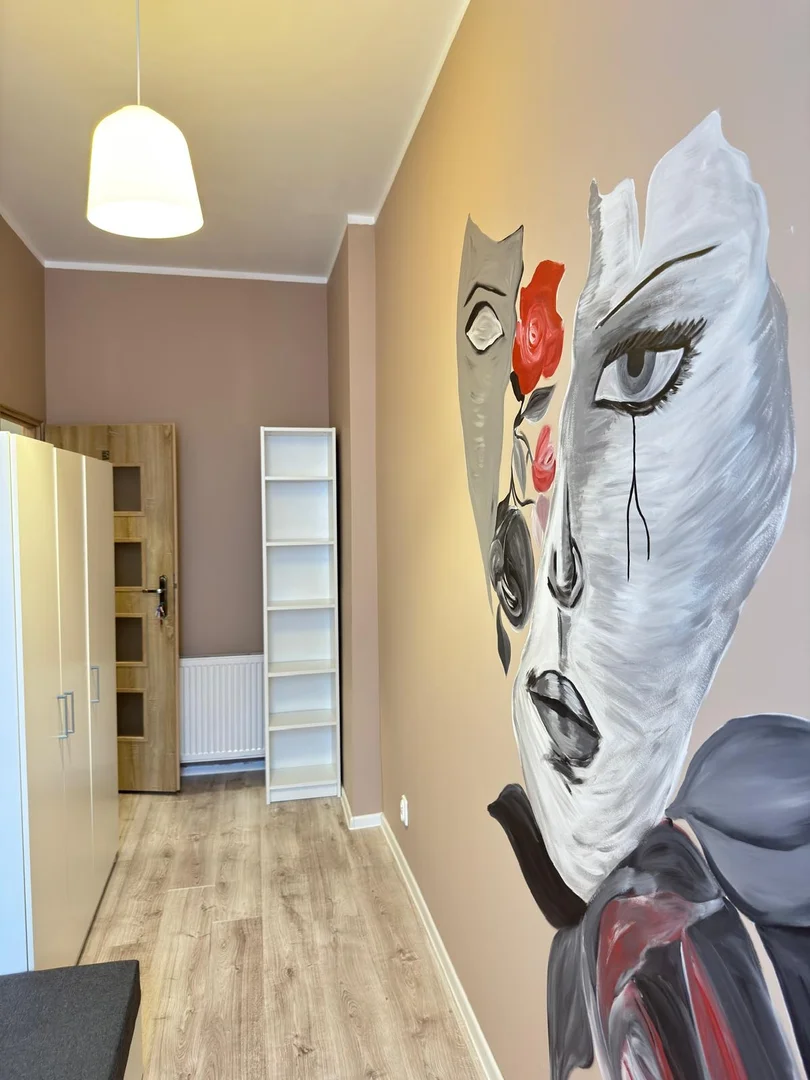 Student room in with study area and shared facilities
