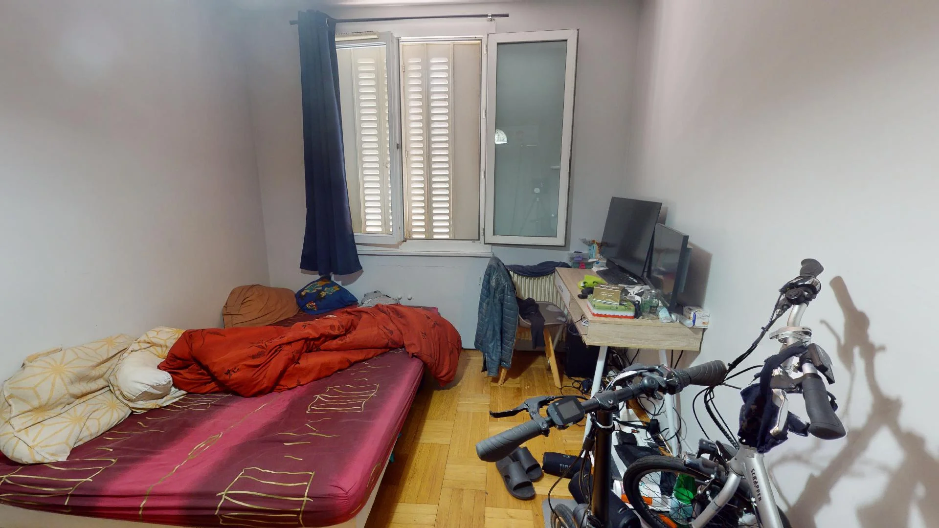 Student room in with study area and shared facilities