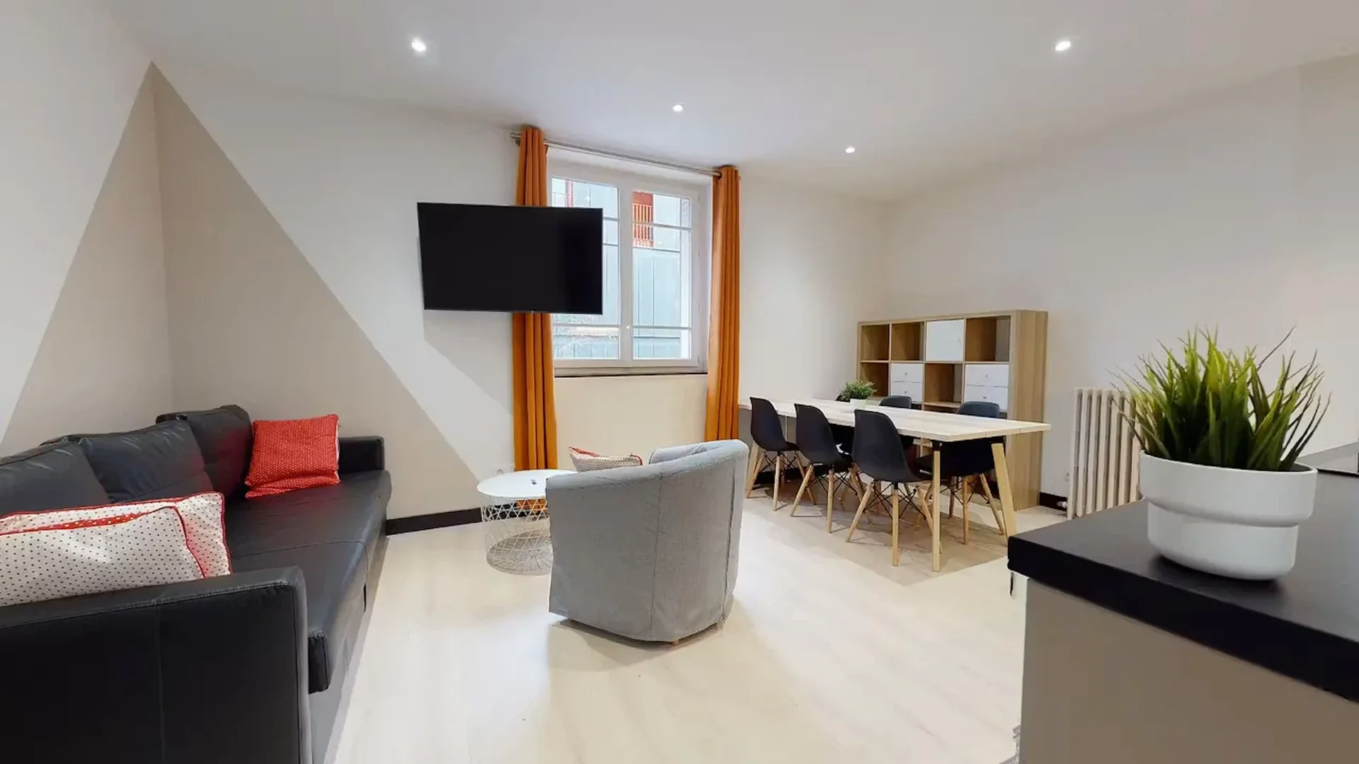 Student room in with study area and shared facilities