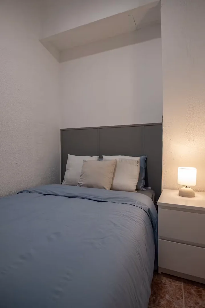 Student room in with study area and shared facilities
