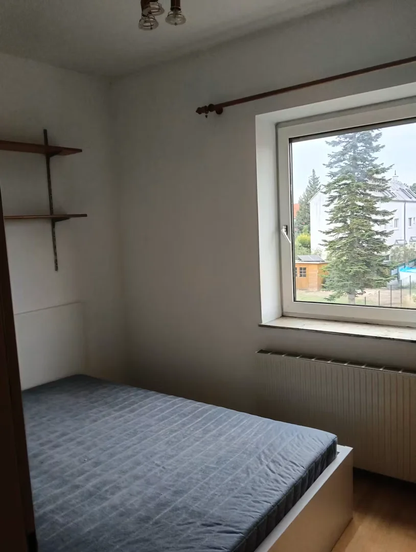 Student room in with study area and shared facilities