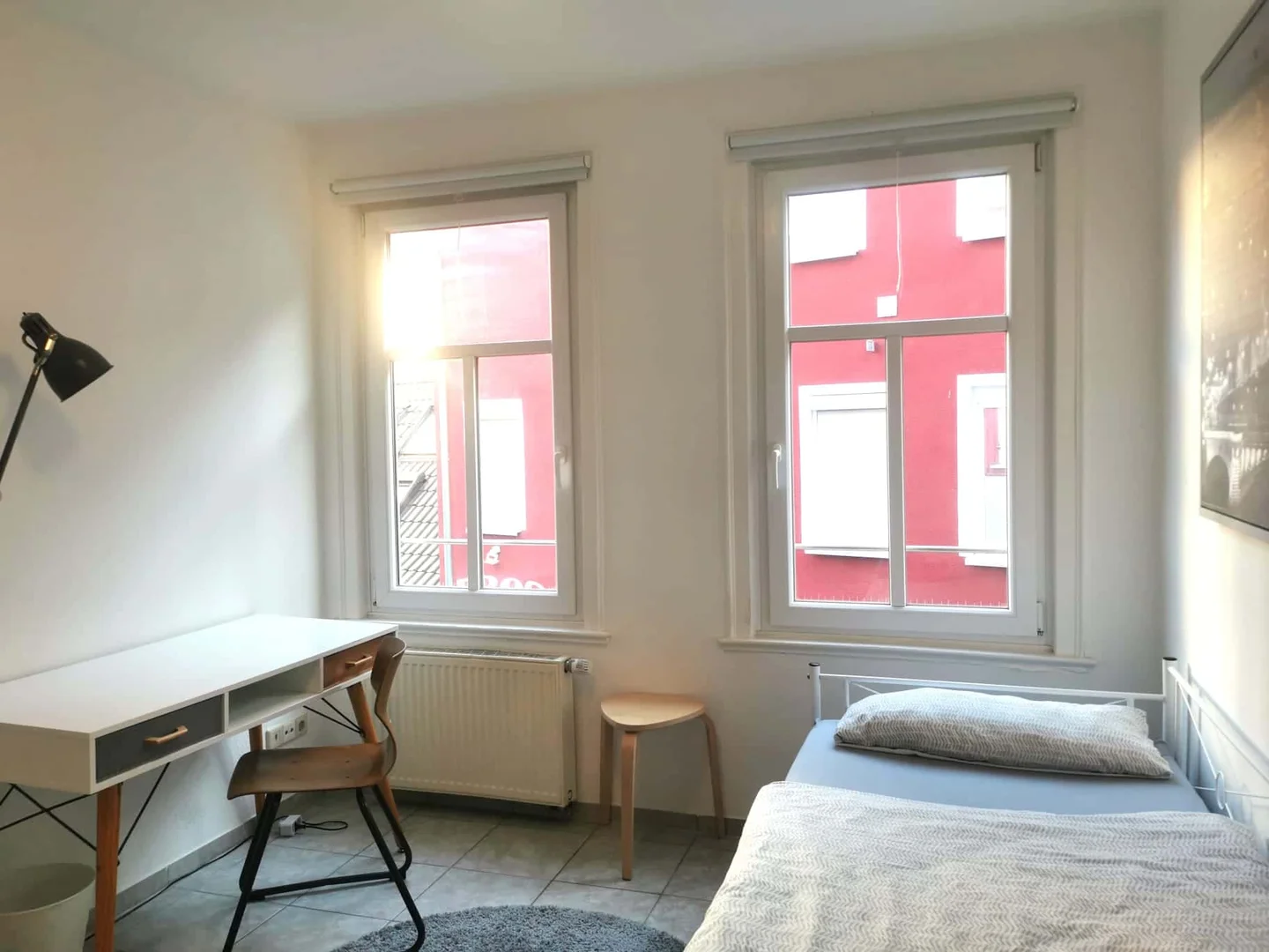 Student room in with study area and shared facilities