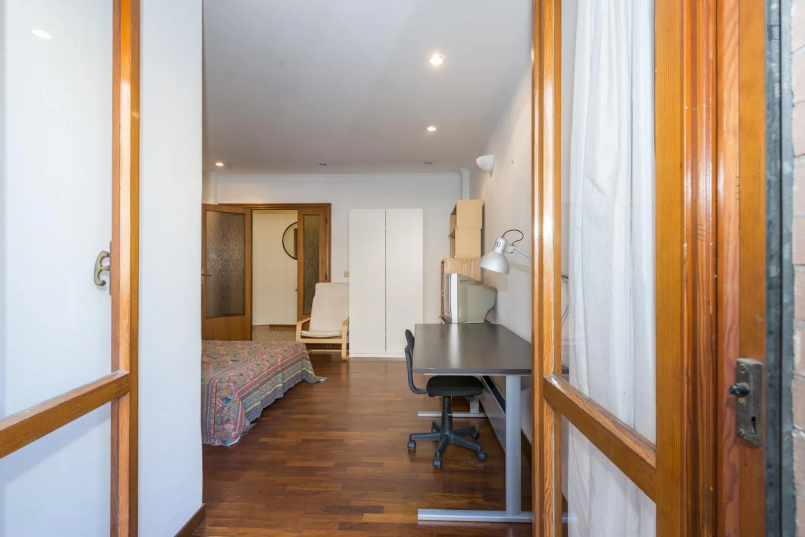 Student room in with study area and shared facilities