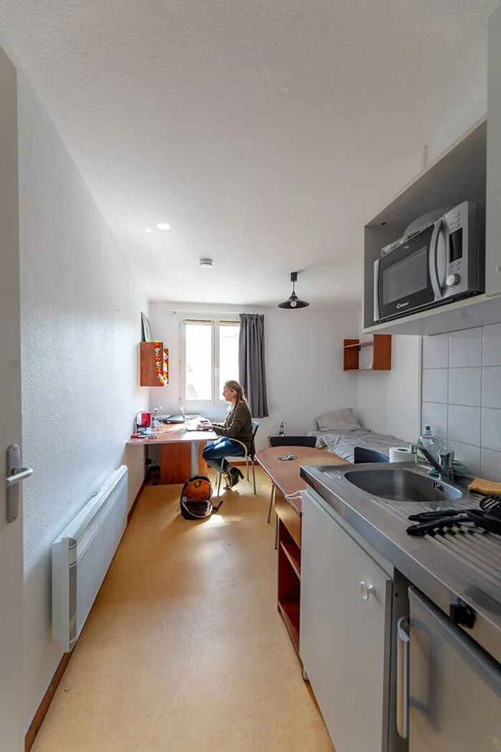 Student room in  with study area and shared facilities
