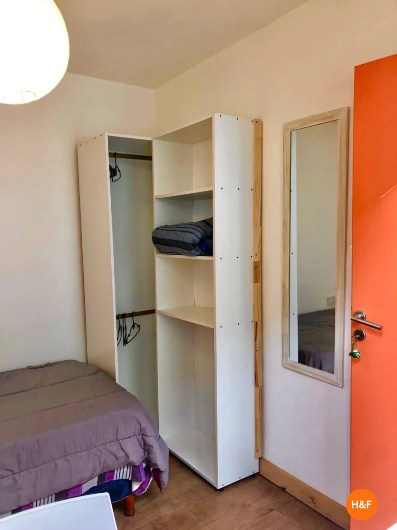 Student room in with study area and shared facilities