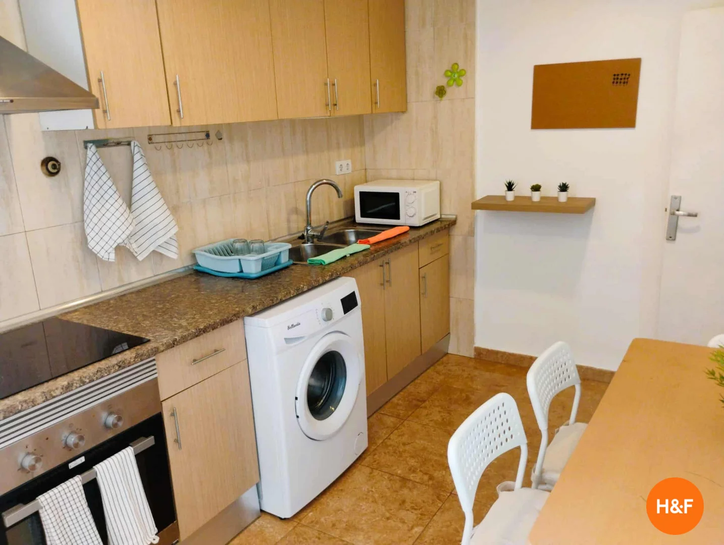 Student room in with study area and shared facilities